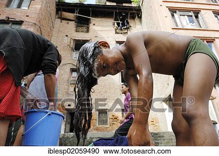 Girl washing her hair, Bhaktapur, Kathmandu Valley, Nepal, Asia View Large Photo Image Stock Image - Girl washing her hair, Bhaktapur, Kathmandu Valley, Nepal, Asia. Fotosearch