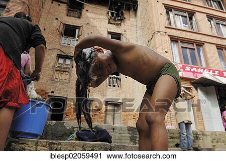 Girl washing her hair, Bhaktapur, Kathmandu Valley, Nepal, Asia View Large Photo Image Stock Image - Girl washing her hair, Bhaktapur, Kathmandu Valley, Nepal, Asia. Fotosearch