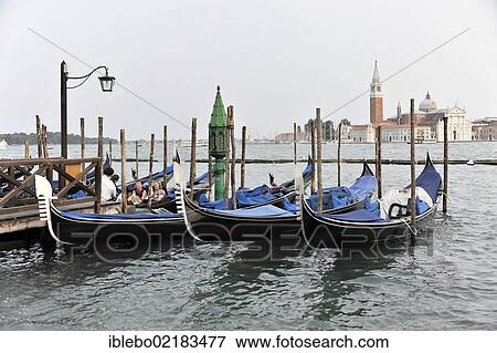 Gondolas at St. Mark's Square, San Giorgio at the rear, Venice, Veneto, Italy, Europe View Large Photo Image Stock Photo - Gondolas at St. Mark's Square, San Giorgio at the rear, Venice, Veneto, Italy, Europe. Fotosearch