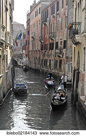 Stock Image - Gondolas, tourists, side channel, Venice, Veneto, Italy, Europe. Fotosearch