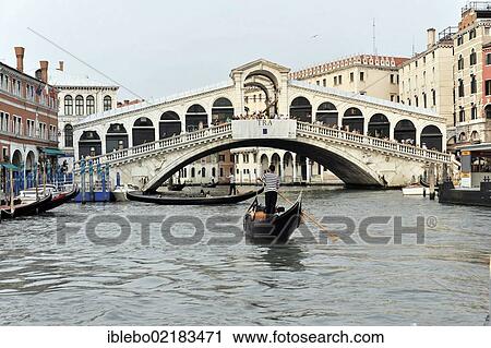 Stock Image - Grand Canal with boats, gondolas and the Rialto Bridge, Venice, Veneto, Italy, Europe. Fotosearch