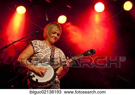 Stock Image - Greta Bondesson, one of the sisters from the Swedish siblings band Baskery, performing live in the Schueuer concert hall, Lucerne, Switzerland, Europe. Fotosearch