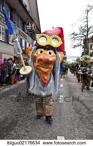 Guggen music, drum major dressed up as poison dwarf, 35th Motteri-Umzug parade in Malters, Lucerne, Switzerland, Europe View Large Photo Image Picture - Guggen music, drum major dressed up as poison dwarf, 35th Motteri-Umzug parade in Malters, Lucerne, Switzerland, Europe. Fotosearch