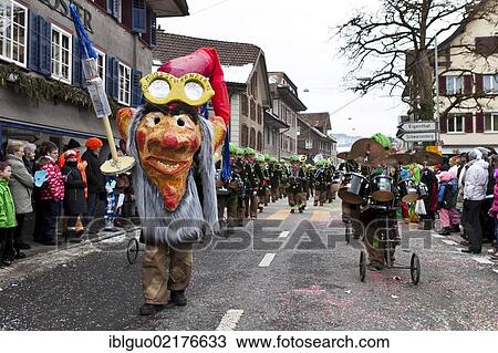 Guggen music, drum major dressed up as poison dwarf, 35th Motteri-Umzug parade in Malters, Lucerne, Switzerland, Europe View Large Photo Image Stock Image - Guggen music, drum major dressed up as poison dwarf, 35th Motteri-Umzug parade in Malters, Lucerne, Switzerland, Europe. Fotosearch