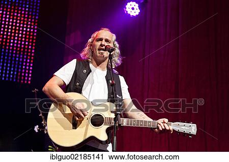 Stock Image - Hannes Hintersteiner of the Austrian pop and folk music group "Schuerzenjaeger" performing live at the Schlager Nacht 2012, pop music event, in Lucerne, Switzerland, Europe. Fotosearch