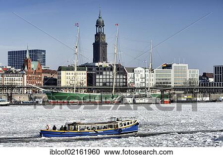 Stock Image - Harbour launch in the winter port of Hamburg, Hamburg, Germany, Europe. Fotosearch