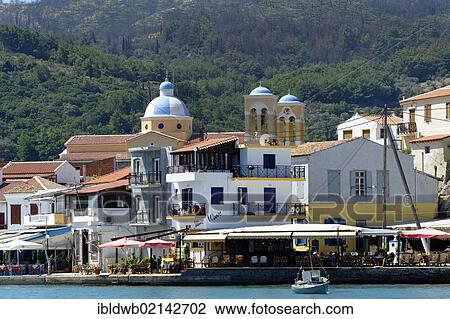 Stock Image - Harbour of Kokkari, with the church of Agios Nikolaos, Samos island, southern Sporades, Aegean sea, Greece, Europe. Fotosearch