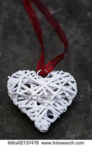 Heart with ribbon on concrete underground View Large Photo Image Stock Photo - Heart with ribbon on concrete underground. Fotosearch