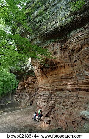 Picture - Hikers in a climbing area, natural monument, Altschlossfelsen or Old Castle Rock in Eppenbrunn, Palatinate Forest Nature Reserve, Rhineland-Palatinate, Germany, Europe. Fotosearch