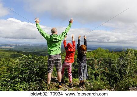Picture - Hikers on the rocks of Koenigsstuhl, Donnersberg Mountain, highest peak of the Palatinate, North Palatine, Rhineland-Palatinate, Germany, Europe. Fotosearch