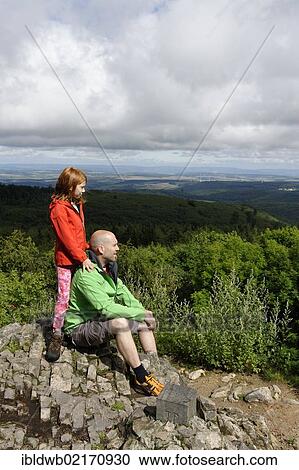 Hikers on the rocks of Koenigsstuhl, Donnersberg Mountain, highest peak of the Palatinate, North Palatine, Rhineland-Palatinate, Germany, Europe View Large Photo Image Stock Image - Hikers on the rocks of Koenigsstuhl, Donnersberg Mountain, highest peak of the Palatinate, North Palatine, Rhineland-Palatinate, Germany, Europe. Fotosearch
