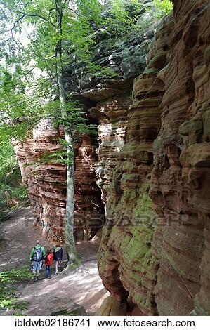 Stock Image - Hikersin a climbing area, natural monument, Altschlossfelsen or Old Castle Rock in Eppenbrunn, Palatinate Forest Nature Reserve, Rhineland-Palatinate, Germany, Europe. Fotosearch