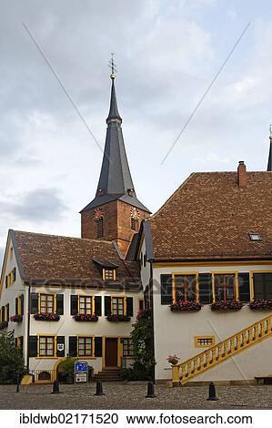 Stock Image - Historic town hall and the parish church of St. Ulrich, Deidesheim, German Wine Road, Palatine Forest, Rhineland-Palatinate, Germany, Europe. Fotosearch