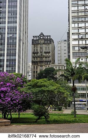 Historical high-rise building, c. 1920, sandwiched between two modern skyscrapers in the town centre of Sao Paulo, Brazil, South America View Large Photo Image Picture - Historical high-rise building, c. 1920, sandwiched between two modern skyscrapers in the town centre of Sao Paulo, Brazil, South America. Fotosearch
