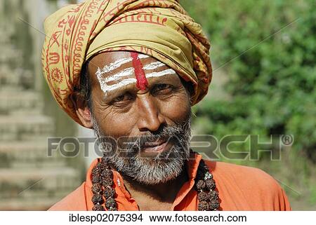 Holy man, Sadhu, with a painted face and a beard, temple complex of Pashupatinath on the sacred Bagmati River, Kathmandu, Nepal, Asia View Large Photo Image Picture - Holy man, Sadhu, with a painted face and a beard, temple complex of Pashupatinath on the sacred Bagmati River, Kathmandu, Nepal, Asia. Fotosearch