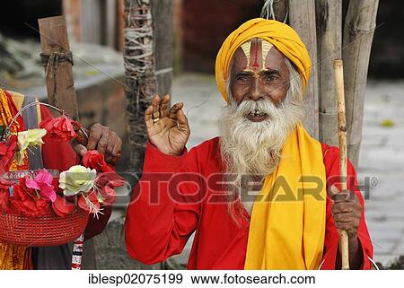 Stock Photo - Holy man, Sadhu, with a painted face and a long beard, Durbar Square, Kathmandu, Nepal, Asia. Fotosearch