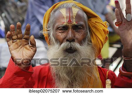 Holy man, Sadhu, with a painted face and a long beard, Durbar Square, Kathmandu, Nepal, Asia View Large Photo Image Stock Photo - Holy man, Sadhu, with a painted face and a long beard, Durbar Square, Kathmandu, Nepal, Asia. Fotosearch