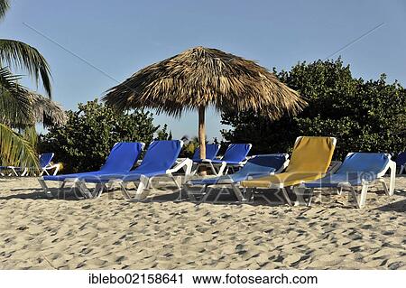 Stock Image - Hotel beach with sunbeds and parasol, 4-star Brisas Trinidad Del Mar Hotel, Trinidad, Cuba, Greater Antilles, Caribbean, Central America, America, North America. Fotosearch