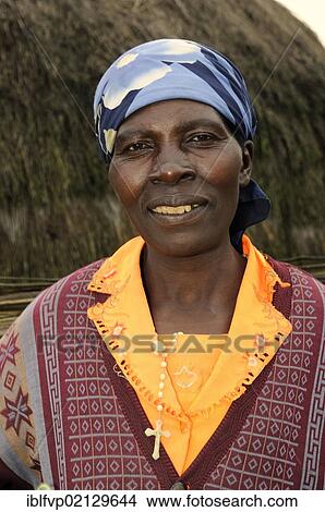 Indigenous woman in the village of Kinigi on the edge of the Volcanoes National Park, Parc National des Volcans, Rwanda, Africa View Large Photo Image Picture - Indigenous woman in the village of Kinigi on the edge of the Volcanoes National Park, Parc National des Volcans, Rwanda, Africa. Fotosearch