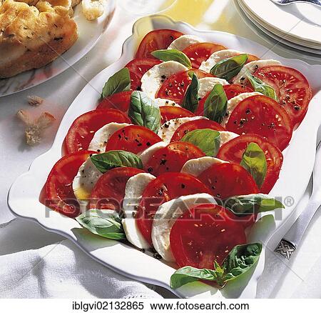 Stock Photography - Insalada caprese, mozzarella with tomatoes, basil and the finest olive oil, Italy, Europe. Fotosearch