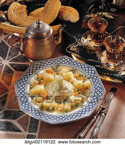 Stock Image - Istanbul style artichokes with celeriac, carrots, peas and potatoes, cold starter, Turkey, Asia. Fotosearch