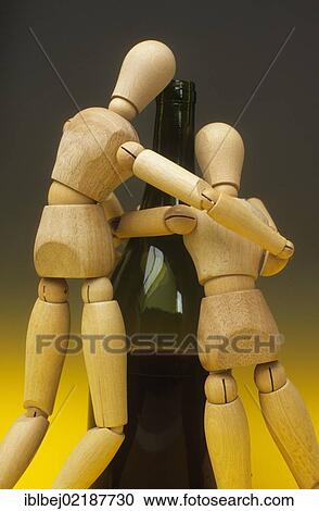 Jointed dolls and wine bottle, symbolic image for alcoholism View Large Photo Image Stock Image - Jointed dolls and wine bottle, symbolic image for alcoholism. Fotosearch