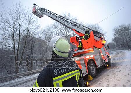 Stock Photo - Ladder of the Stuttgart Fire Brigade illuminating an accident site on the Mittleren Filderstrasse road, Stuttgart, Baden-Wuerttemberg, Germany, Europe. Fotosearch