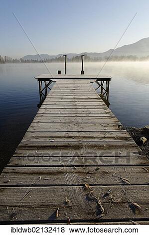 Lake Kochel with morning fog near Schlehdorf, Pfaffenwinkel, Upper Bavaria, Bavaria, Germany, Europe View Large Photo Image Stock Photo - Lake Kochel with morning fog near Schlehdorf, Pfaffenwinkel, Upper Bavaria, Bavaria, Germany, Europe. Fotosearch