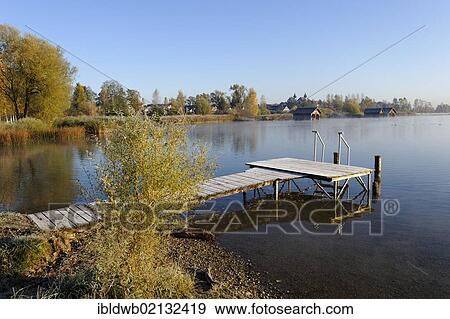 Lake Kochel with morning fog near Schlehdorf, Pfaffenwinkel, Upper Bavaria, Bavaria, Germany, Europe View Large Photo Image Stock Photo - Lake Kochel with morning fog near Schlehdorf, Pfaffenwinkel, Upper Bavaria, Bavaria, Germany, Europe. Fotosearch