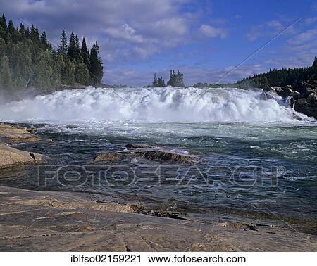 Stock Image - Laksfors, waterfall over several levels used by salmon as natural steps, near Mosjoen, Nordland, Norway, Scandinavia, Europe. Fotosearch