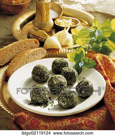 Lebanese cheese balls, feta cheese, goat's cheese and full-fat cream cheese with pine nuts in finely chopped mint, cold starter, Lebanon, Asia View Large Photo Image Picture - Lebanese cheese balls, feta cheese, goat's cheese and full-fat cream cheese with pine nuts in finely chopped mint, cold starter, Lebanon, Asia. Fotosearch