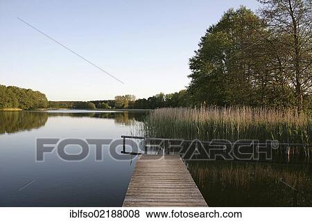 Stock Photo - Linstower See Lake with jetty near Linstow, Mecklenburg Lake District, Mecklenburg-Western Pomerania, Germany, Europe. Fotosearch