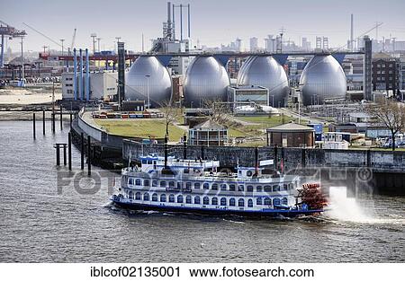 Stock Image - Louisiana Star steamer and Koehlbrandhoeft sewage works, port of Hamburg, Germany, Europe. Fotosearch