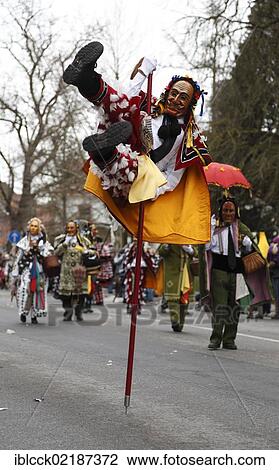 Stock Image - Man dressed up as Federahannes, Narrensprung carnival in Rottweil, Rottweiler Fasnet carnival, Swabian-Alemannic carnival, Baden-Wuerttemberg, Germany, Europe. Fotosearch