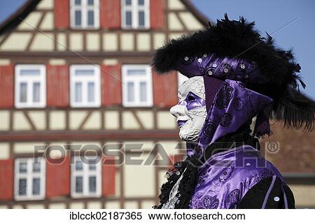 Man wearing a mask standing in front of half-timbered house, Hallia Venezia carnival, Schwaebisch Hall, Baden-Wuerttemberg, Germany, Europe View Large Photo Image Stock Photography - Man wearing a mask standing in front of half-timbered house, Hallia Venezia carnival, Schwaebisch Hall, Baden-Wuerttemberg, Germany, Europe. Fotosearch