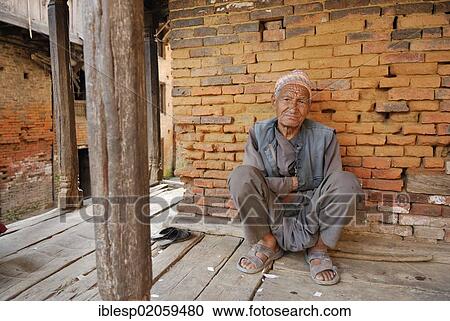 Stock Image - Man with traditional headewear, Bhaktapur, Kathmandu Valley, Nepal, Asia. Fotosearch