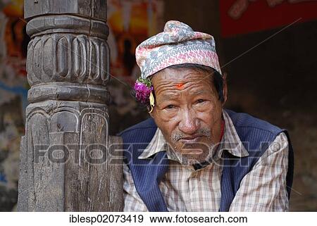 Man with traditional headwear, Bhaktapur, Kathmandu Valley, Nepal, Asia View Large Photo Image Stock Photo - Man with traditional headwear, Bhaktapur, Kathmandu Valley, Nepal, Asia. Fotosearch