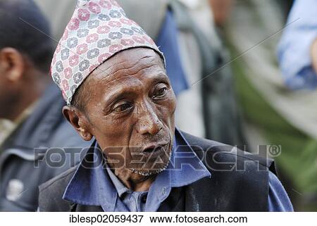 Man with traditional headwear, Taumadhi square, Bhaktapur, Kathmandu Valley, Nepal, Asia View Large Photo Image Stock Photo - Man with traditional headwear, Taumadhi square, Bhaktapur, Kathmandu Valley, Nepal, Asia. Fotosearch