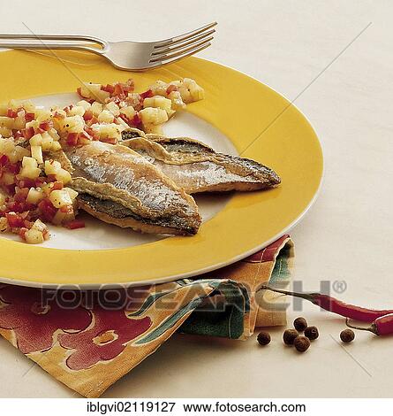 Stock Photo - Marinated fish, fried with cucumbers, bell peppers, onions and chili, cold starter, Jamaica, North America. Fotosearch