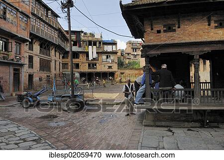 Men at historic square, Bhaktapur, Kathmandu Valley, Nepal, Asia View Large Photo Image Stock Image - Men at historic square, Bhaktapur, Kathmandu Valley, Nepal, Asia. Fotosearch