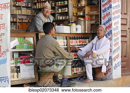 Men sitting in front of a shop, Kathmandu, Nepal, Asia View Large Photo Image Stock Photo - Men sitting in front of a shop, Kathmandu, Nepal, Asia. Fotosearch