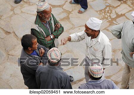 Men talking on Taumadhi square, Bhaktapur, Kathmandu Valley, Nepal, Asia View Large Photo Image Stock Image - Men talking on Taumadhi square, Bhaktapur, Kathmandu Valley, Nepal, Asia. Fotosearch