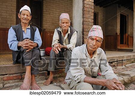 Men with traditional headwear, Bhaktapur, Kathmandu Valley, Nepal, Asia View Large Photo Image Stock Photo - Men with traditional headwear, Bhaktapur, Kathmandu Valley, Nepal, Asia. Fotosearch