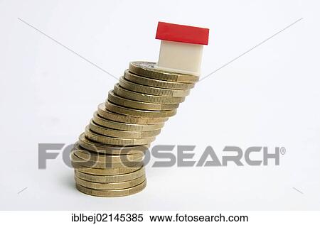 Stock Photography - Miniature house on stack of coins, symbolic image real estate. Fotosearch