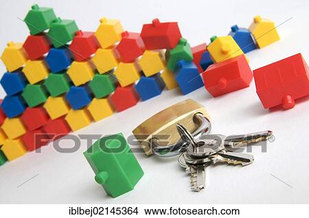 Miniature houses, padlock and keys, symbolic image real estate View Large Photo Image Picture - Miniature houses, padlock and keys, symbolic image real estate. Fotosearch