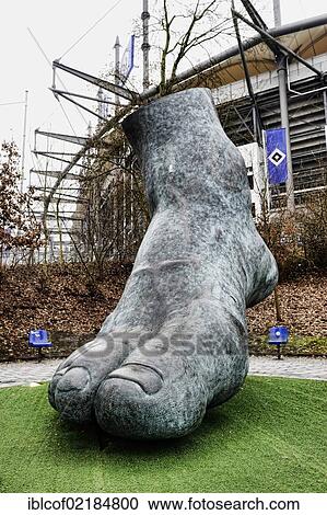 Stock Image - Monument, foot of football legend Uwe Seeler by Brigitte Schmitges, Imtech Arena stadium in Hamburg, Germany, Europe. Fotosearch