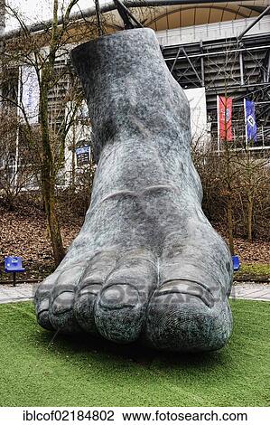 Stock Image - Monument, foot of football legend Uwe Seeler by Brigitte Schmitges, Imtech Arena stadium in Hamburg, Germany, Europe. Fotosearch