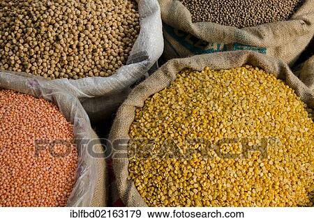 Stock Photo - Moong Dhal, Urid Dhal and other types of lentils for sale on the market in the suburb of Paharganj, New Delhi, India, Asia. Fotosearch