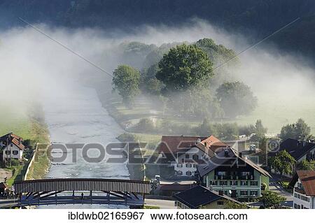 Morning fog in Eschenlohe on the Loisach River, Upper Bavaria, Bavaria, Germany, Europe View Large Photo Image Stock Photo - Morning fog in Eschenlohe on the Loisach River, Upper Bavaria, Bavaria, Germany, Europe. Fotosearch