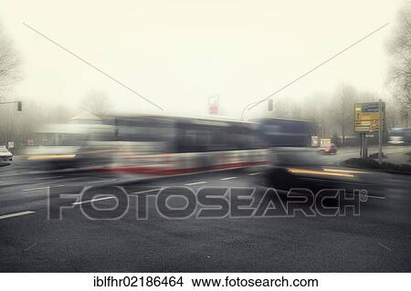 Morning traffic at an intersection in the early morning mist, motion blur View Large Photo Image Picture - Morning traffic at an intersection in the early morning mist, motion blur. Fotosearch